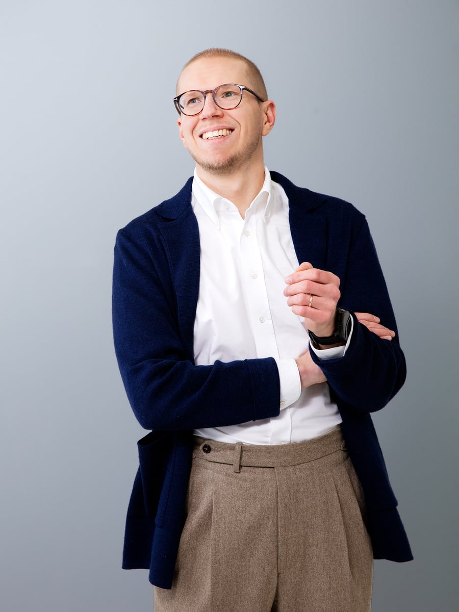 Eero Siivola smiling in a navy jacket